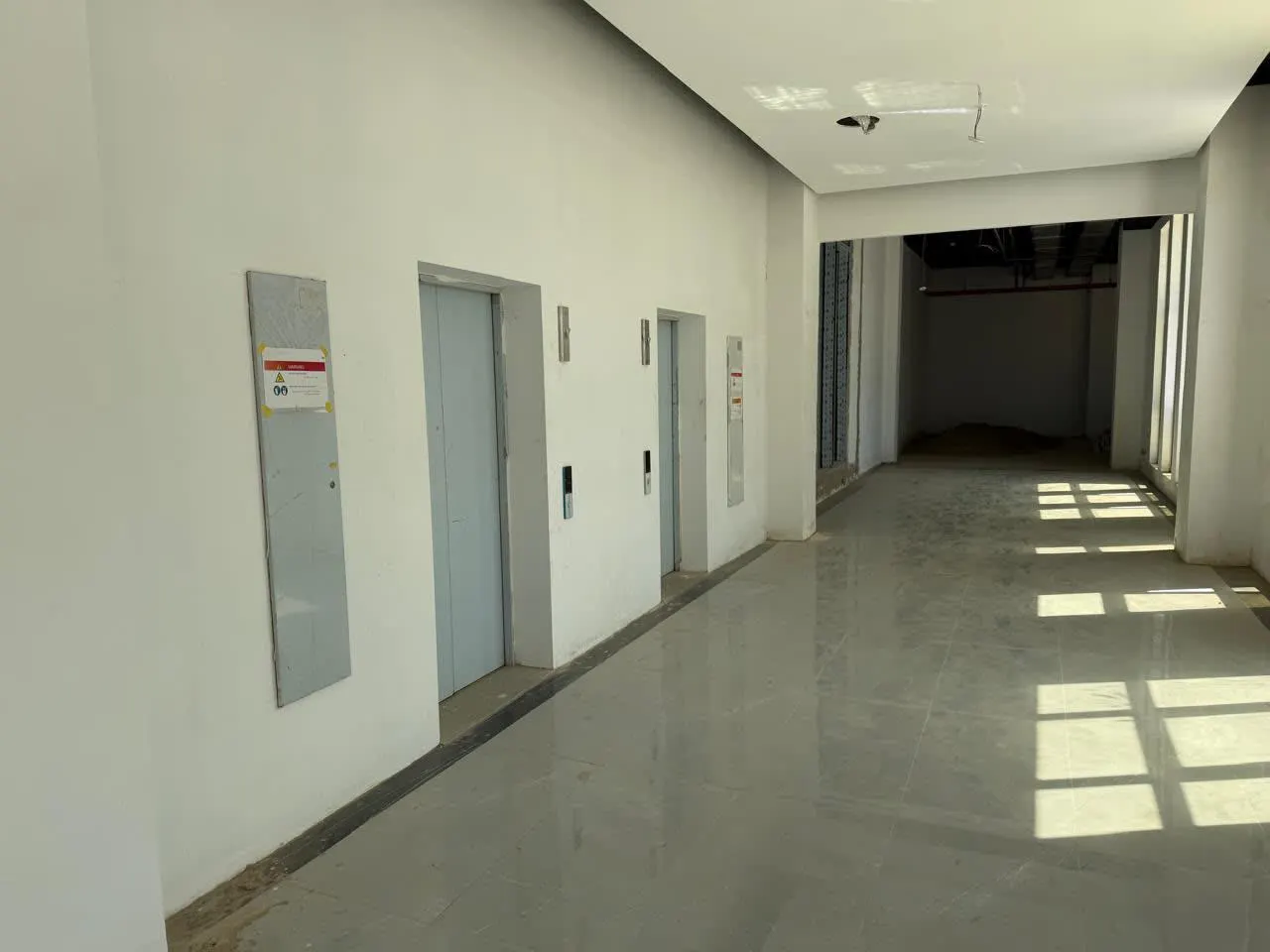 Marble lift lobby and corridor of an administrative building with offices for rent in First Settlement