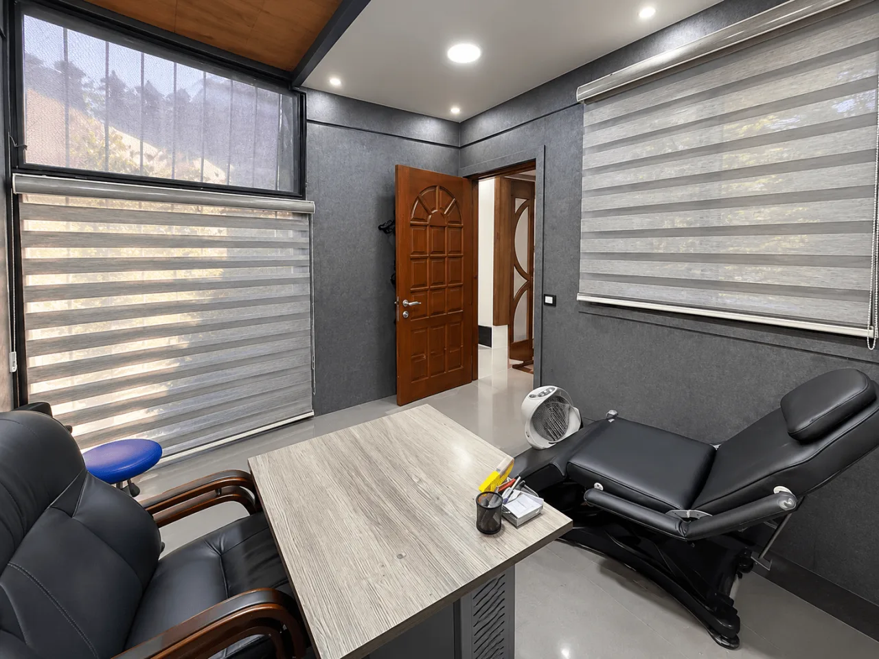 Equipped treatment room with reclining chairs and blinds in a clinic for rent in Maadi Corniche
