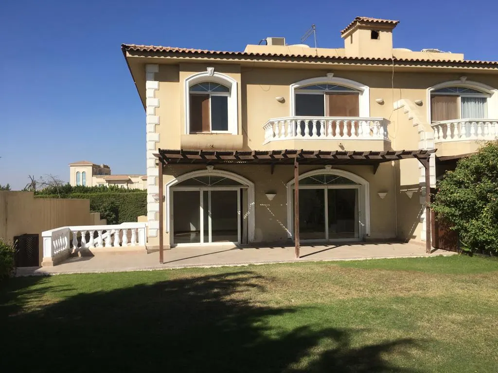 Two-storey standalone villa with arched windows, a pergola and a lawn in Fifth Settlement, New Cairo