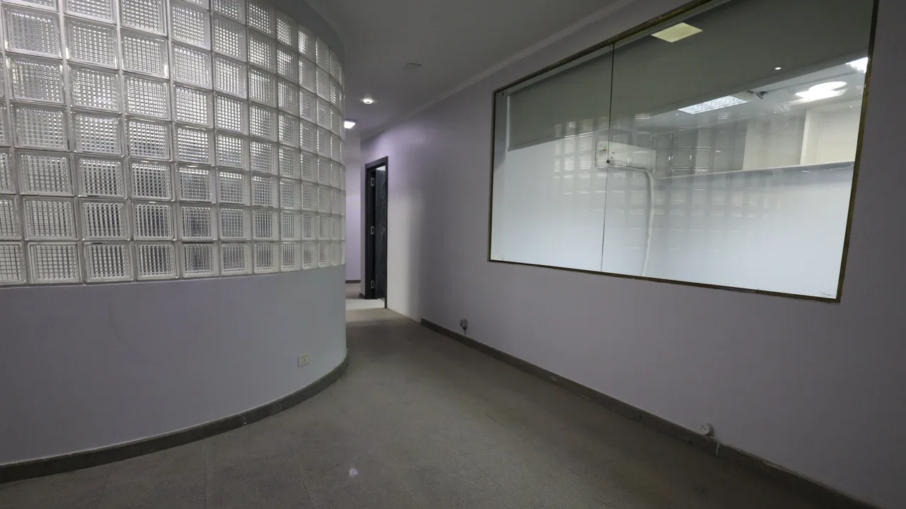 Office room with a curved glass-block wall and a glazed internal partition in an office for rent in Sarayat El Maadi