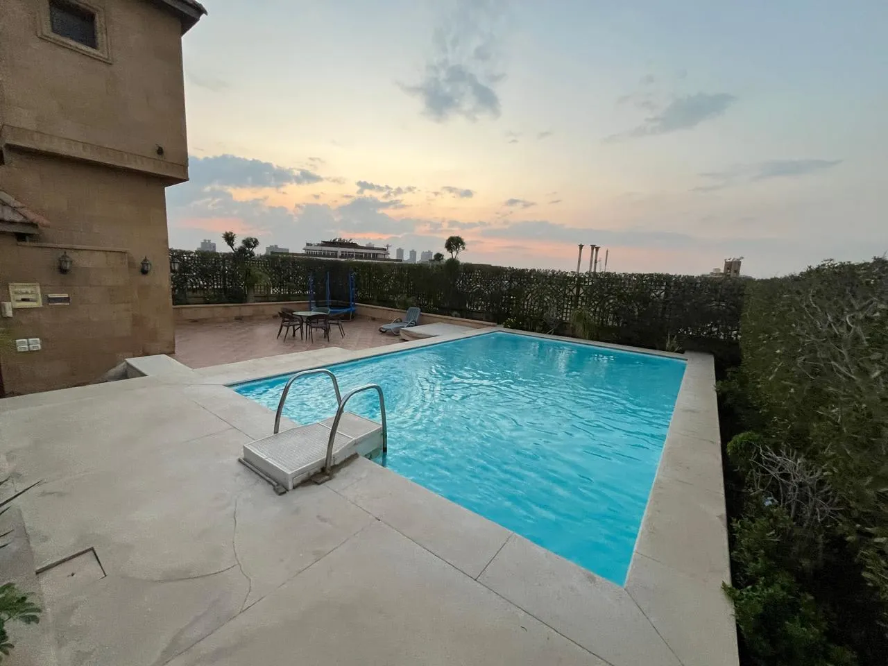Private rooftop swimming pool at sunset at a penthouse in Sarayat El Maadi, Cairo