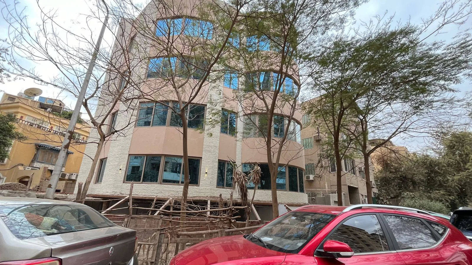 Administrative building on a tree-lined street in Degla, Maadi