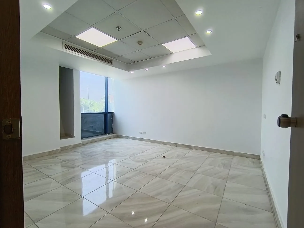 Finished clinic reception with marble floors and wide windows for rent in Maadi Corniche
