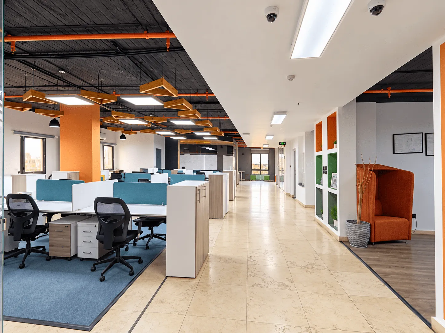 Fully finished open-plan full floor with workstations and orange accents in New Cairo, Cairo