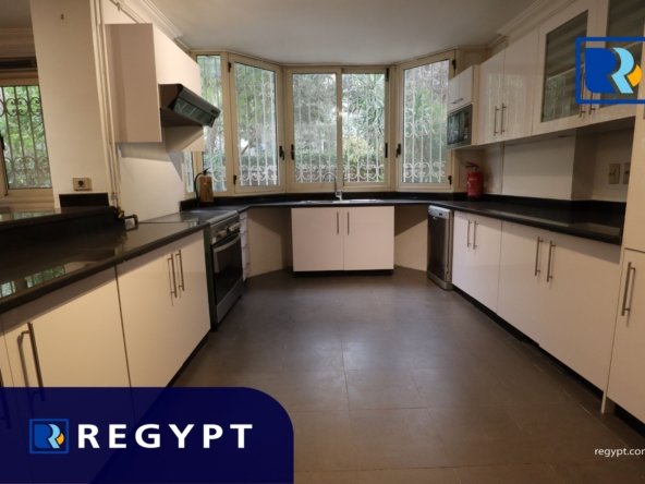 Kitchen full of appliances in a Ground Floor With Pool