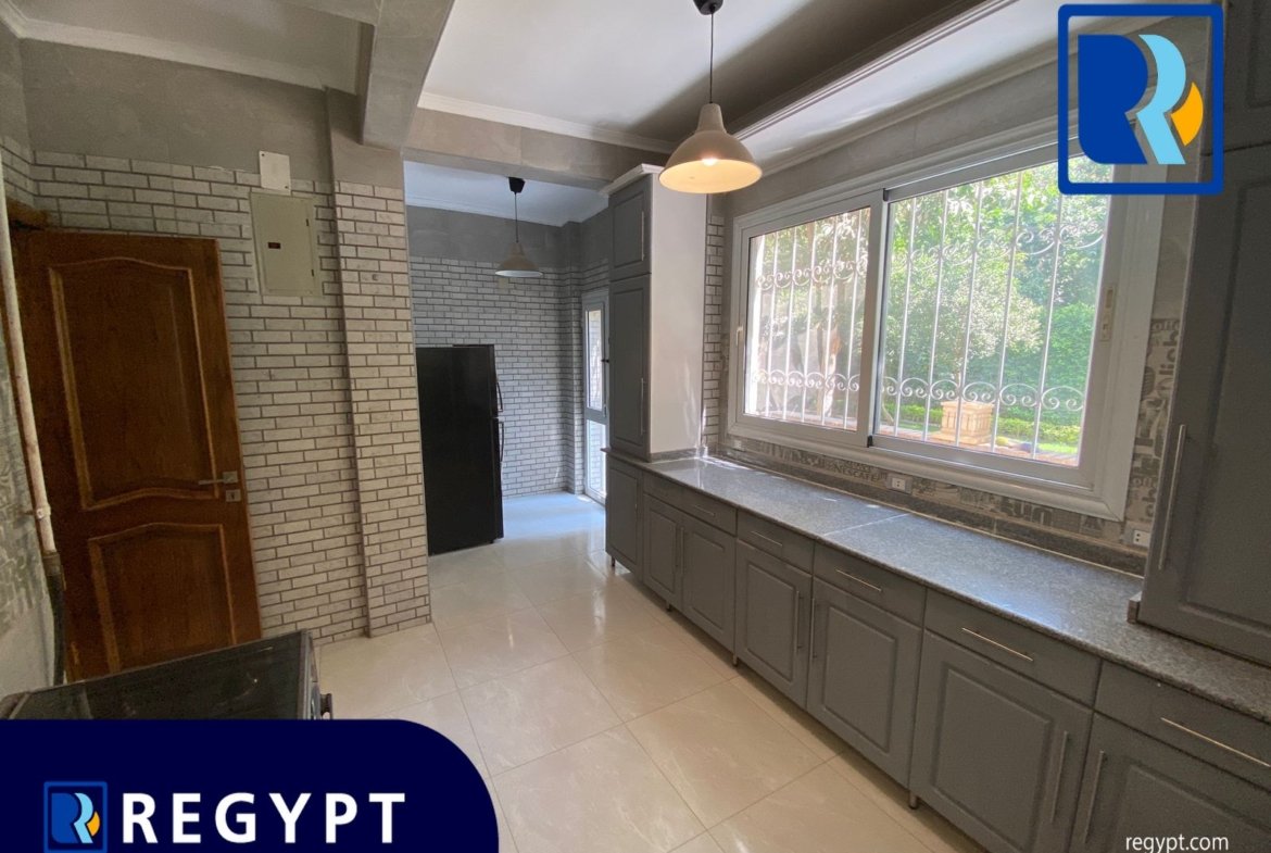 Kitchen full of appliances in a Ground Floor With Huge Garden