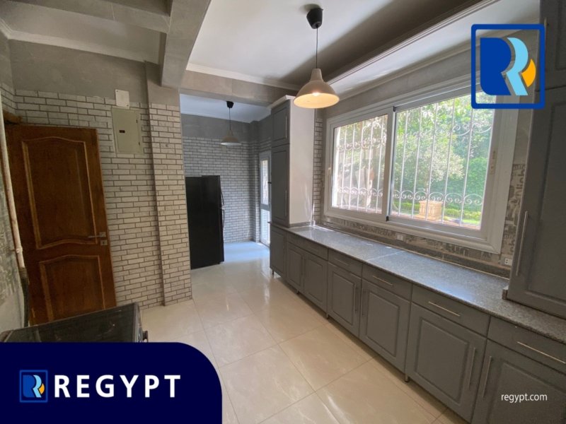 Kitchen full of appliances in a Ground Floor With Huge Garden