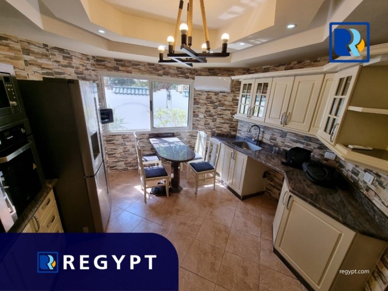 Kitchen full of appliances in a Luxury ground floor in maadi