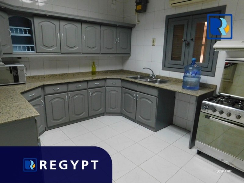 Kitchen full of appliances in a Ground Floor With Garden in maadi for rent