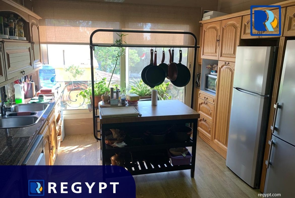 Kitchen full of appliances in a Ideal Apartment For Rent