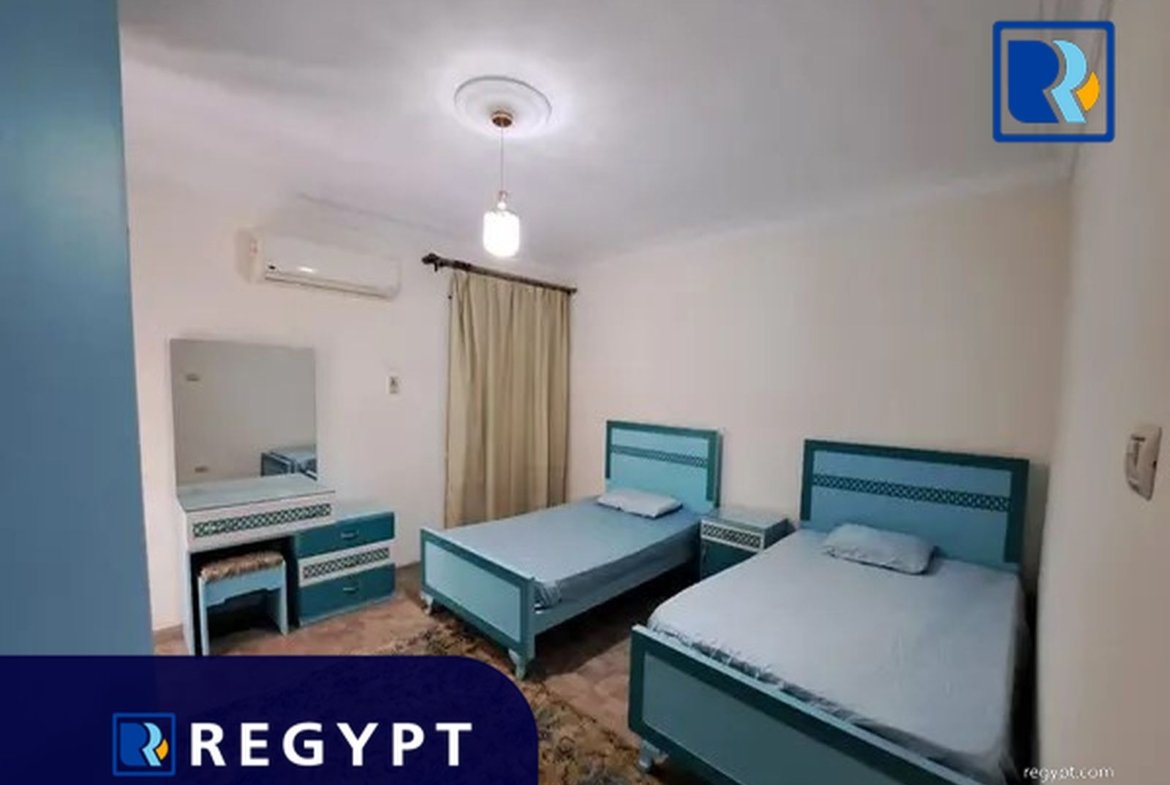 Bedroom with two small beds in a Affordable Rental Apartment
