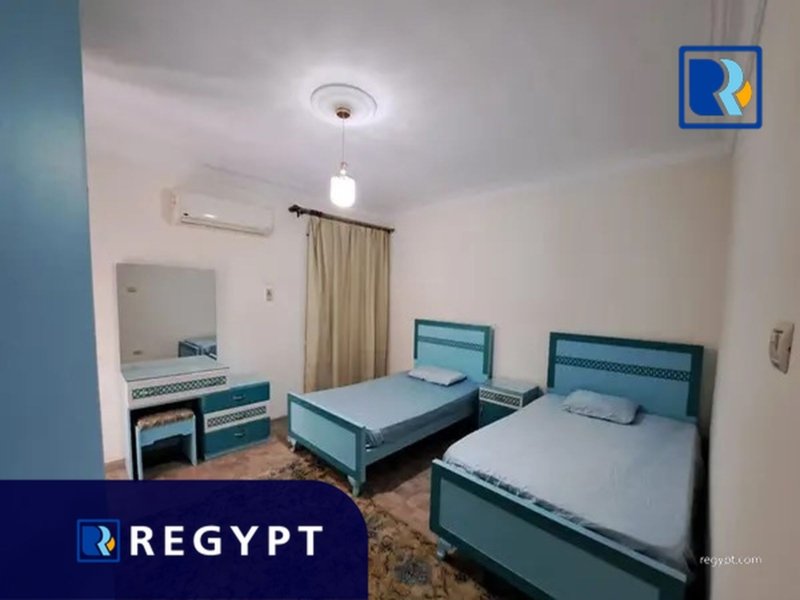 Bedroom with two small beds in a Affordable Rental Apartment