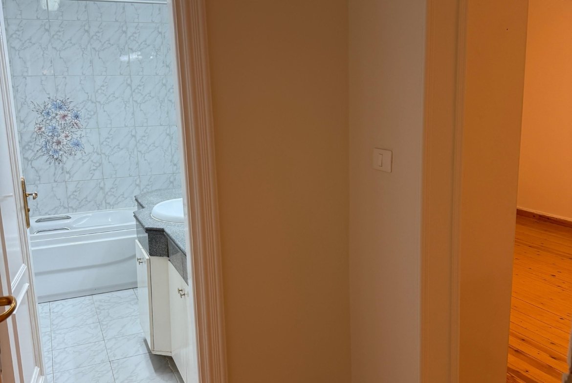 Another bathroom with bathtub in this Nice Finishing Apartment In Maadi