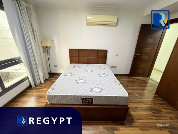 Bedroom with wooden floor in a Sunny Apartment For Rent In Maadi