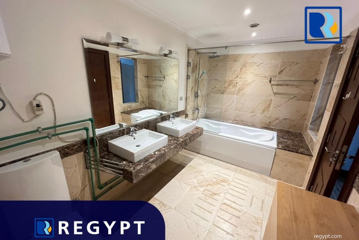 Bathroom with bathtub in a Sunny Apartment For Rent In Maadi