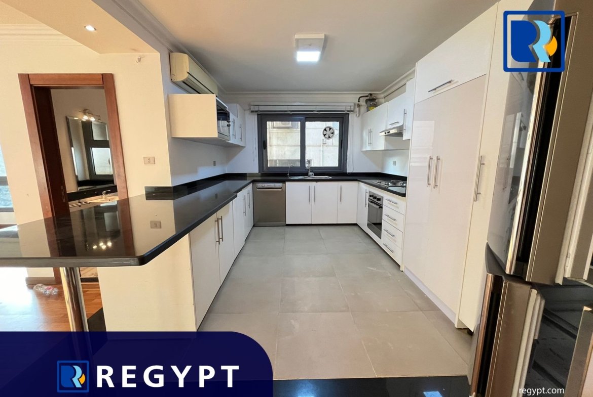 Kitchen full of appliances in a Sunny Apartment For Rent In Maadi
